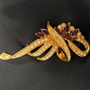 Gold-Tone Floral Ribbon Brooch with Burgundy Crystals